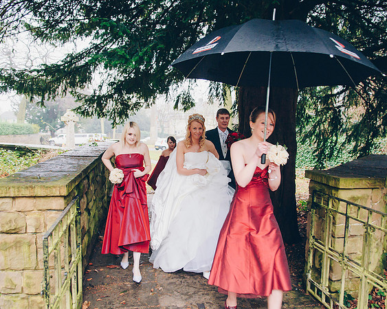 bride and bridesmaids arriving at church for a rainy sheffield wedding