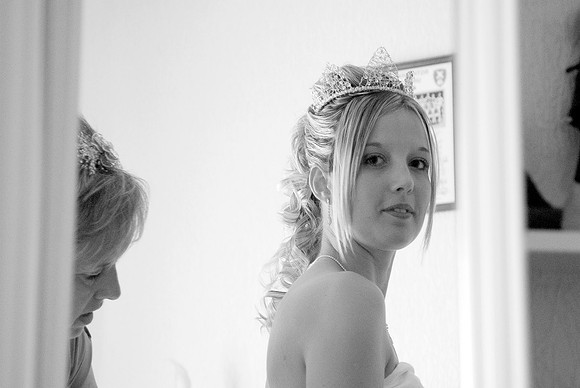 black and white wedding picture of bride preparing for wedding at whiston church in rotherham