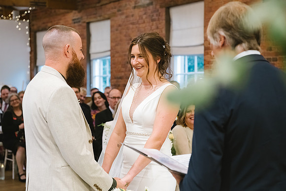 bride and groom stood on bridge near heathland grove in derbyshire