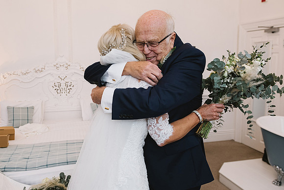 wedding photography of father of the bride embrace at aston hall hotel near sheffield