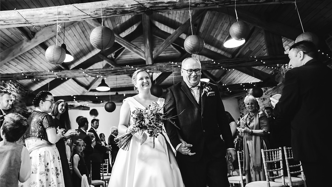 sheffield wedding photography of bride and groom walking back down the aisle at wood lane countryside centre