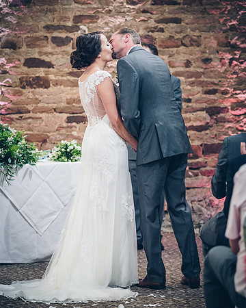 bride and groom kiss at wedding ceremony at mosborough hall