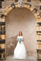 Ringwood hall bride in archway by wedding photographer Dan Mogan Photography