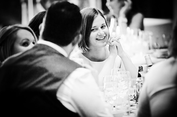 reportage photograph of wedding guests enjoying the reception