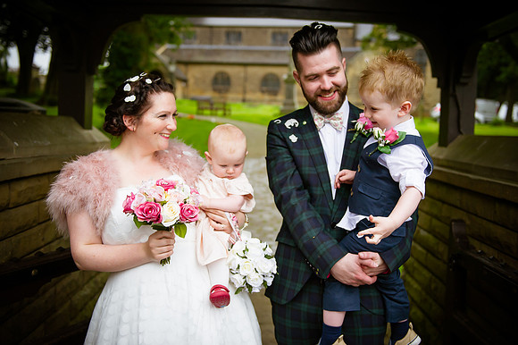 Newly married couple outside East Arsley Church near Wakefield by wedding photographer Dan Mogan Photography