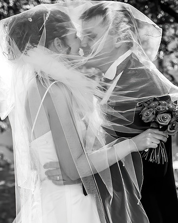 black and white photo of couple kissing at The Stables near Doncaster by wedding photographer Dan Mogan Photography