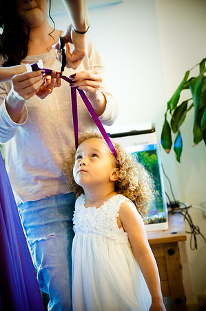 Reportage photo of young bridemaid getting ready by wedding photographer Dan Mogan Photography