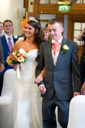 Bride lead down the aisle at Sheffield Town Hall by wedding photographer Dan Mogan Photography