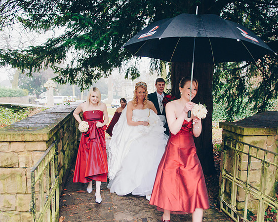 sheffield wedding photography picture of bride and bridesmaids arriving at church in the rain