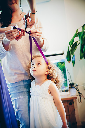 Reportage photo of young bridemaid getting ready by wedding photographer Dan Mogan Photography