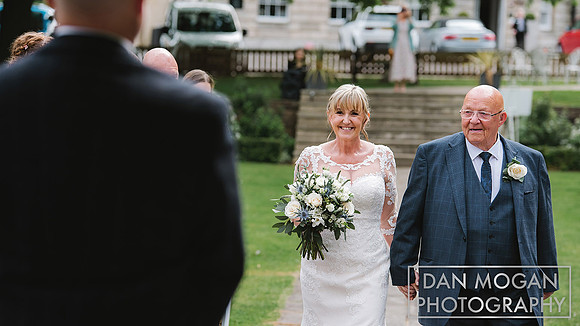 reportage aston hall wedding photographer picture of bride walking down the aisle
