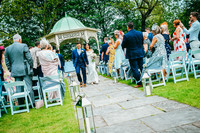 newly weds walking back down aisle at aston hall hotel