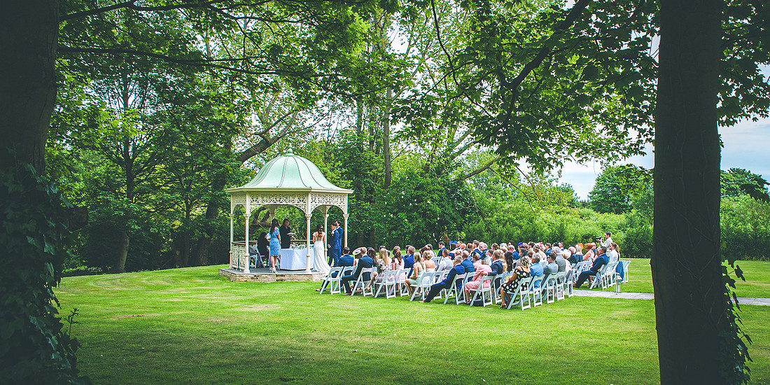 wedding ceremony on front lawn of aston hall hotel in south yorkshire