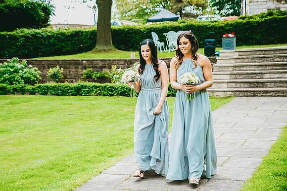 bridesmaids walking down the aisle at aston hall hotel wedding