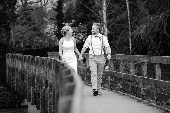 black and white wedding photography of bride and groom kissing at hellaby hall in rotherham
