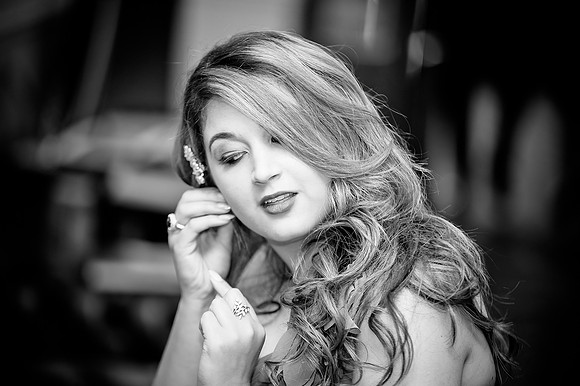 reportage wedding photography of bridesmaid adjusting her earring at wortley hall in sheffield