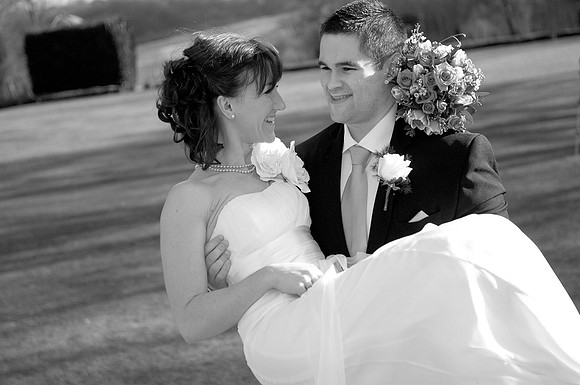 chesterfield wedding photographer image of bride being carried by groom