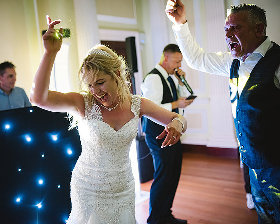 reportage-wedding-photography-of-bride-and-groom-singing-and-dancing-at-normanby-hall-scunthorpe