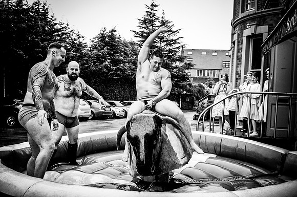 fund reportage wedding photography on rodeo bull at leeds wedding reception