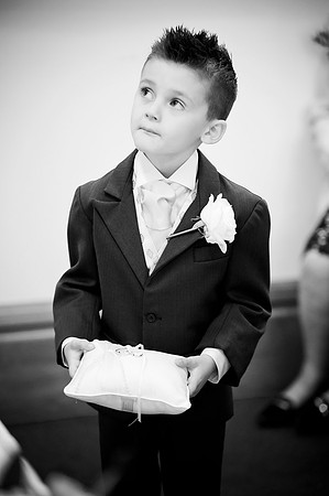 black and white wedding photograph of pageboy looking after the wedding ring at sheffield town hall