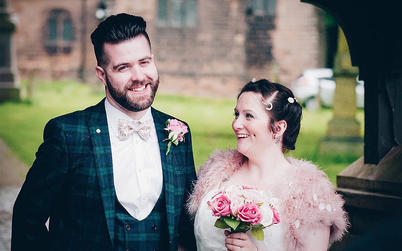 wedding photographer yorkshire bride and groom smiling outside church